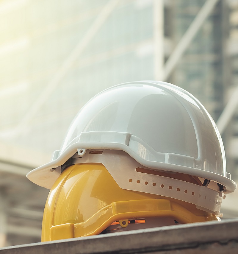 white, yellow hard safety helmet hat for safety project of workm