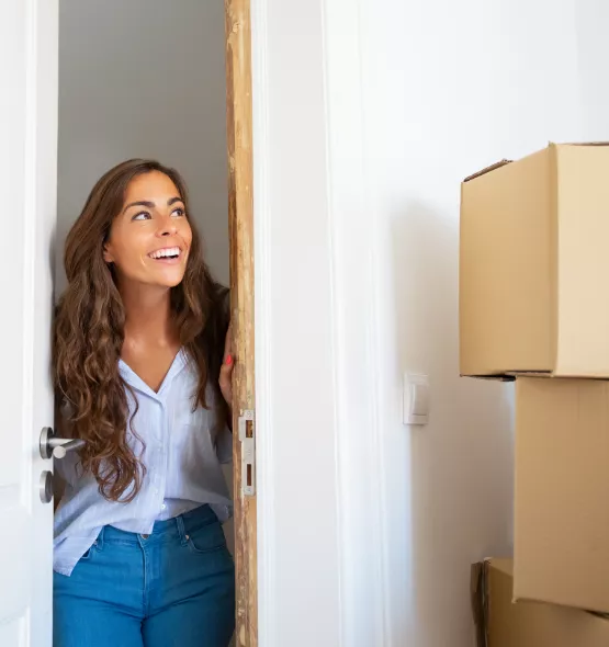 women entering new apartment